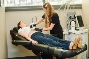 Nurse Jordan providing body contouring for patient